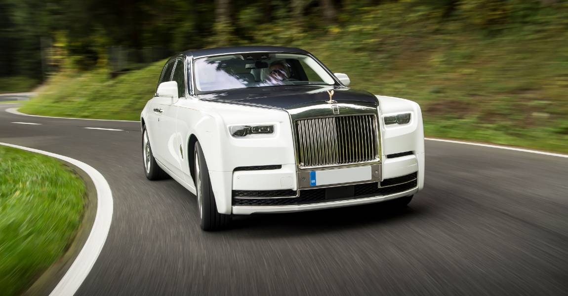 white rolls royce driving with PPF on Luxury Car